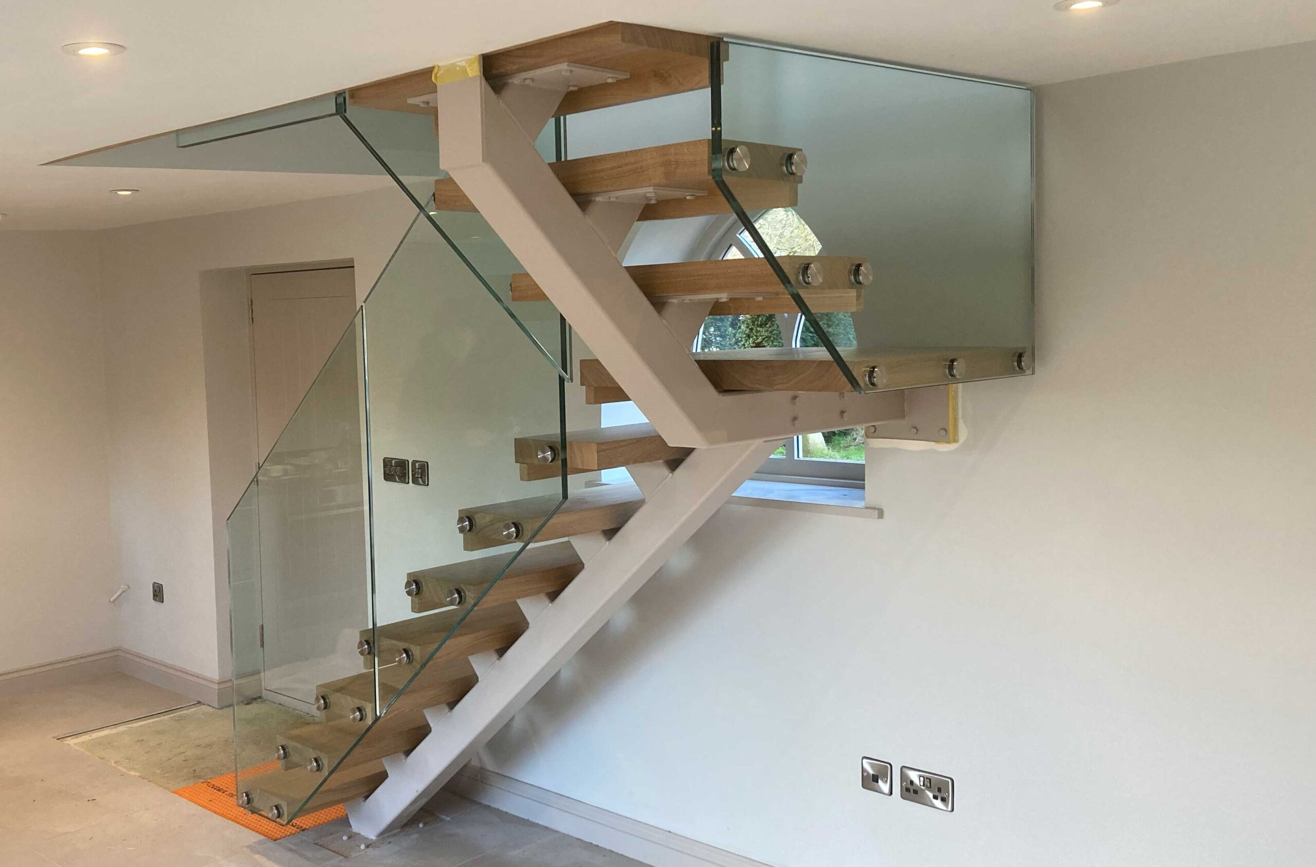 Bespoke Staircase Manufacturer 8 Bespoke metal-and-glass staircase with floating oak tre