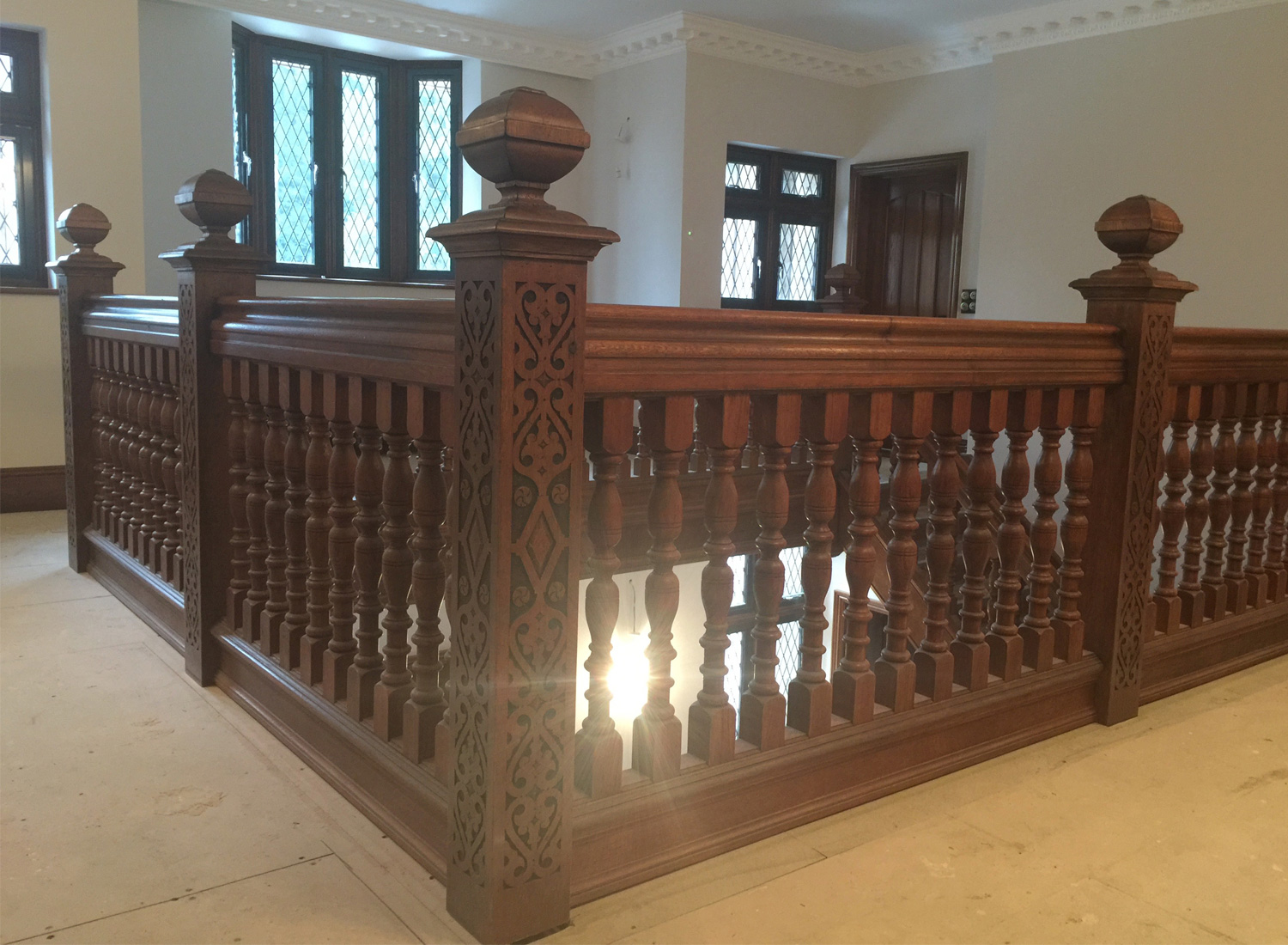 Bespoke hand-carved oak staircase by Reeve & Co