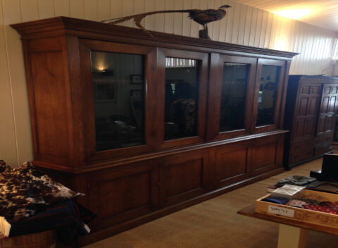 Four door glazed gun cupboard