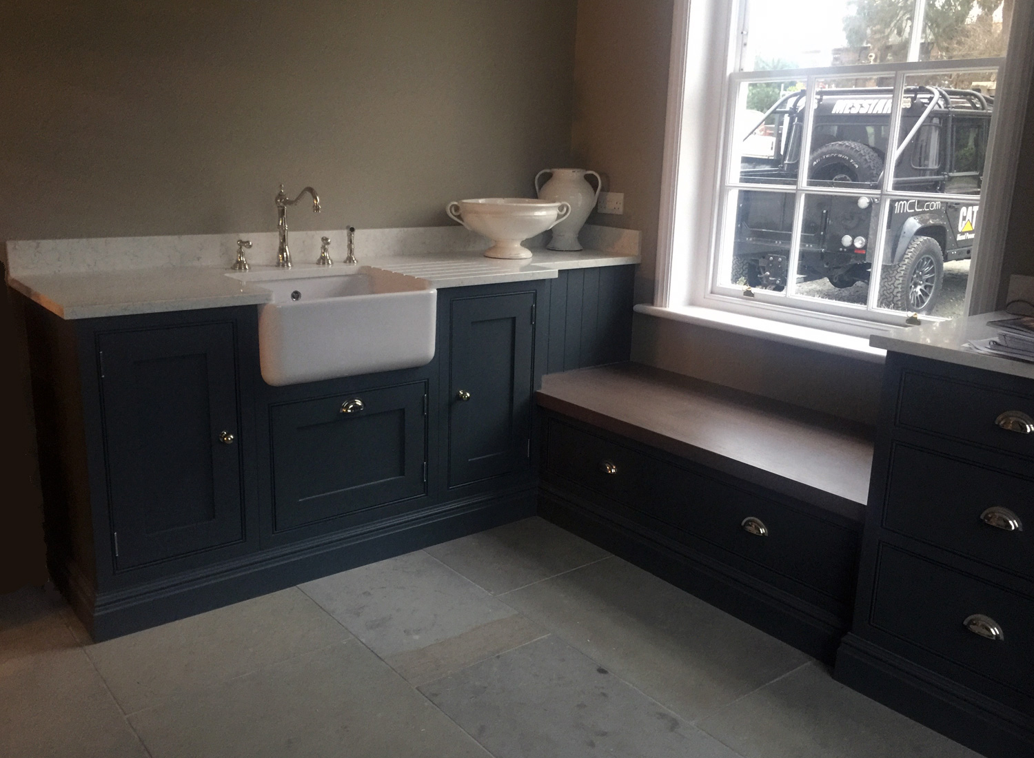 Painted boot room with oak bench and storage