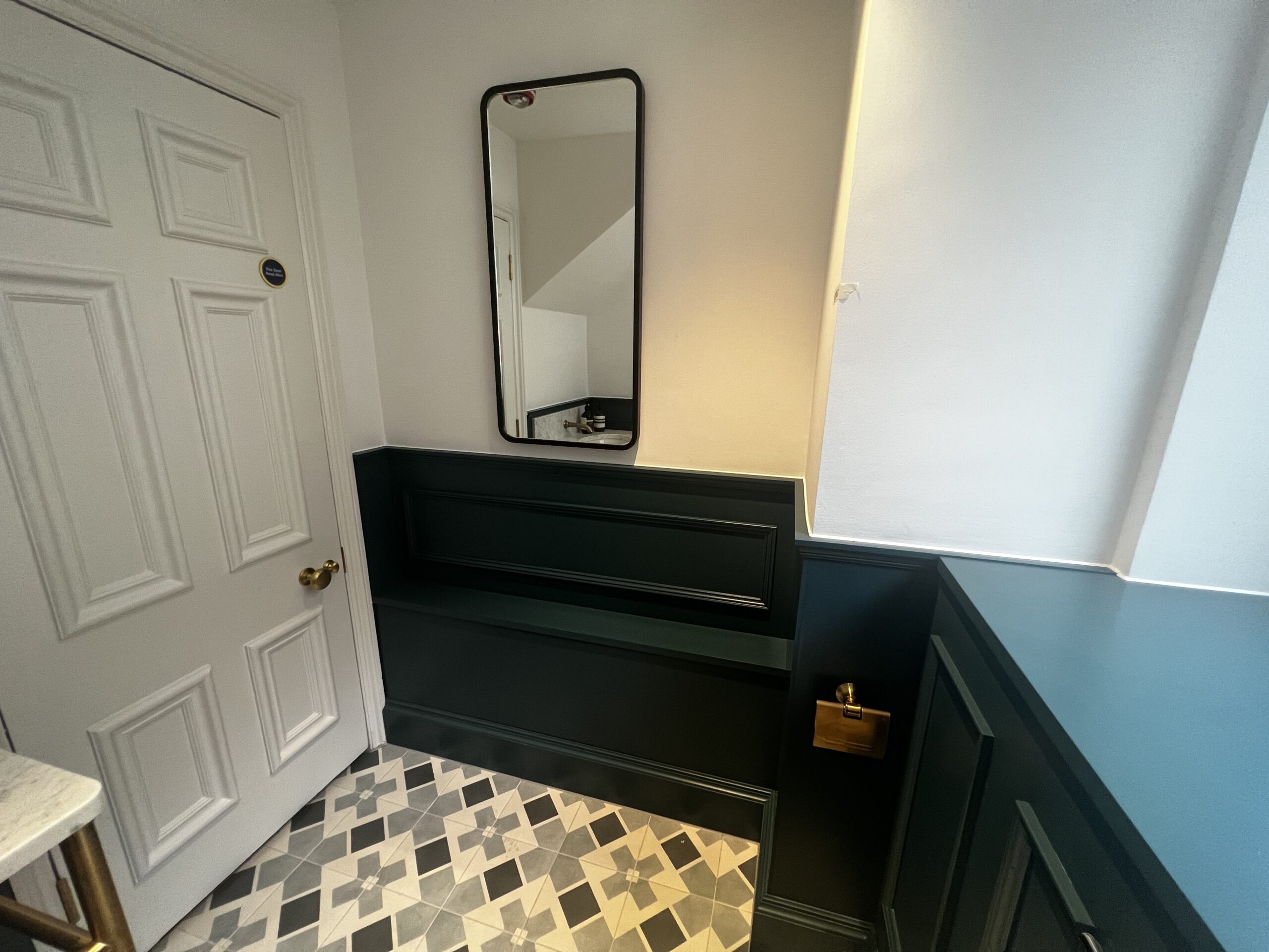 Bespoke Mirrored Walls 7 Low-level panelling with bespoke mirror in a private interior