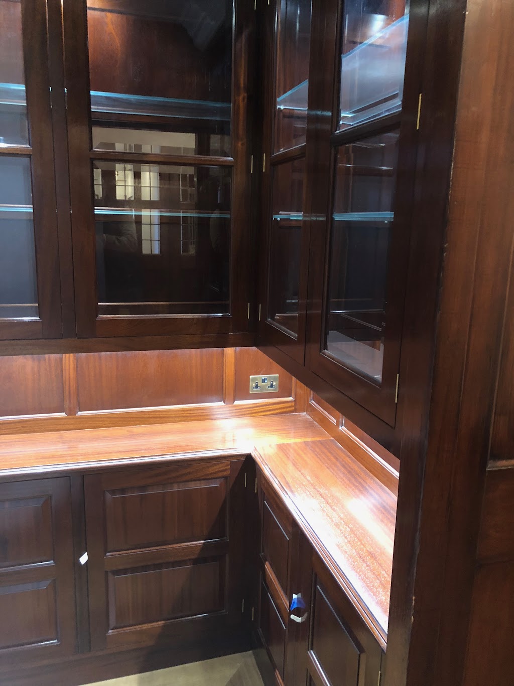 Commissioning bespoke joinery: a short guide for architects and designers 1 Dark oak fitted study with panelled cabinetry and glazed display cabinets — bespoke joinery by Reeve & Co, Oxford, Oxfordshire