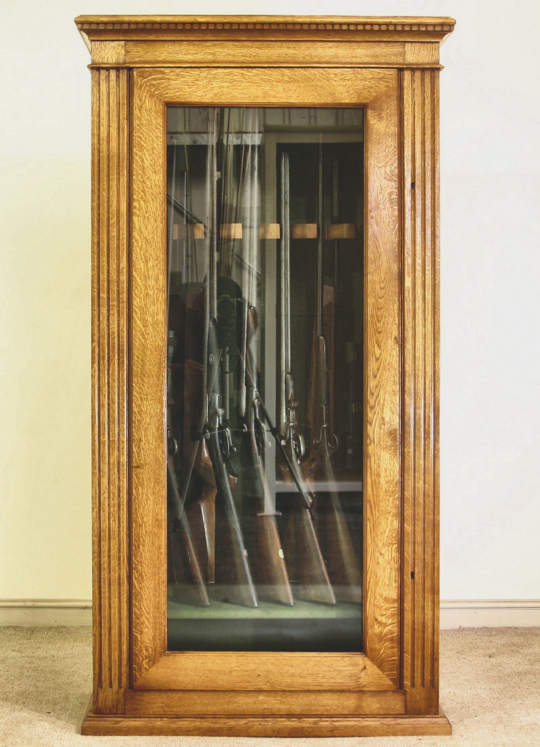 Bespoke Gun Rooms and Gun Cabinets 2 Glazed oak gun cabinet with dentil cornice and fluted pilasters holding shotguns and rifles