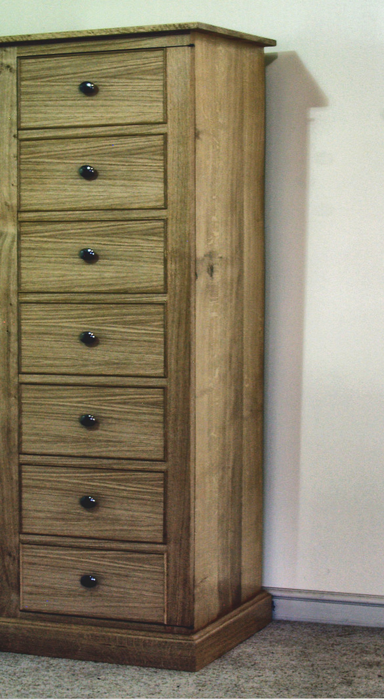 Four-Door Glazed Gun Cupboard for a Large Collection 4 Seven-drawer Wellington chest in pale oak for cartridge and scope storage