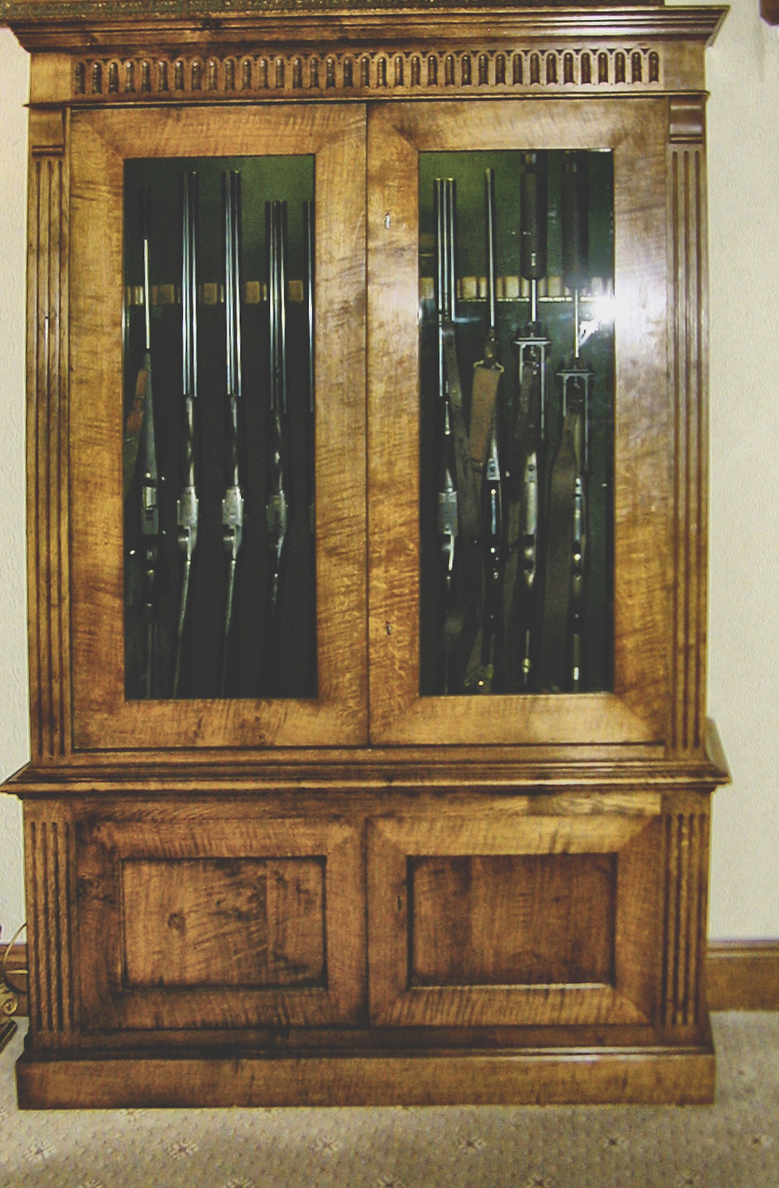 Bespoke Gun Rooms and Gun Cabinets 1 Antiqued figured oak gun cabinet with dentil frieze and twin glazed doors over a panelled base