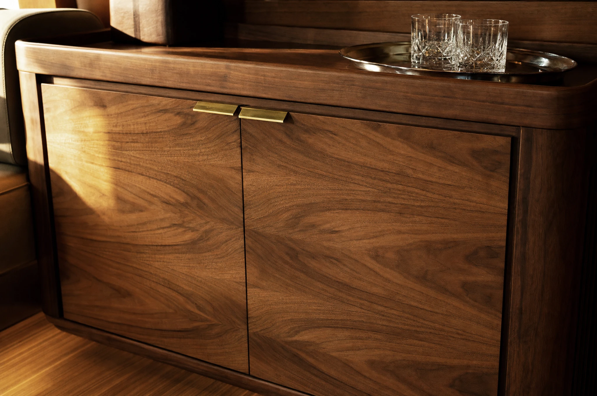 Book-matched walnut sideboard detail, superyacht dining saloon — Reeve & Co design study
